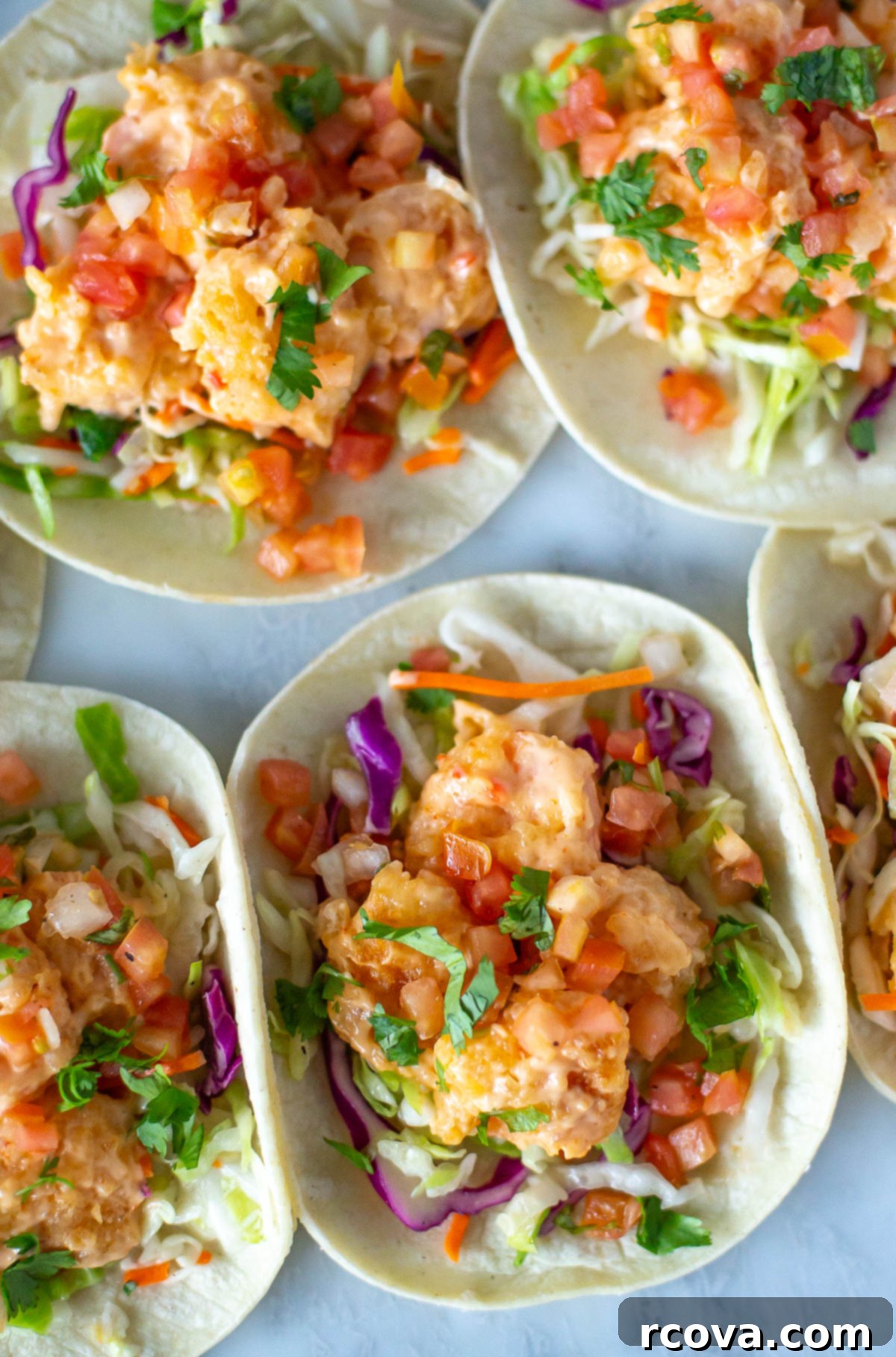 Spicy Bang Bang Shrimp Tacos 8 Close-up shot of assembled bang bang shrimp tacos, showcasing the vibrant ingredients