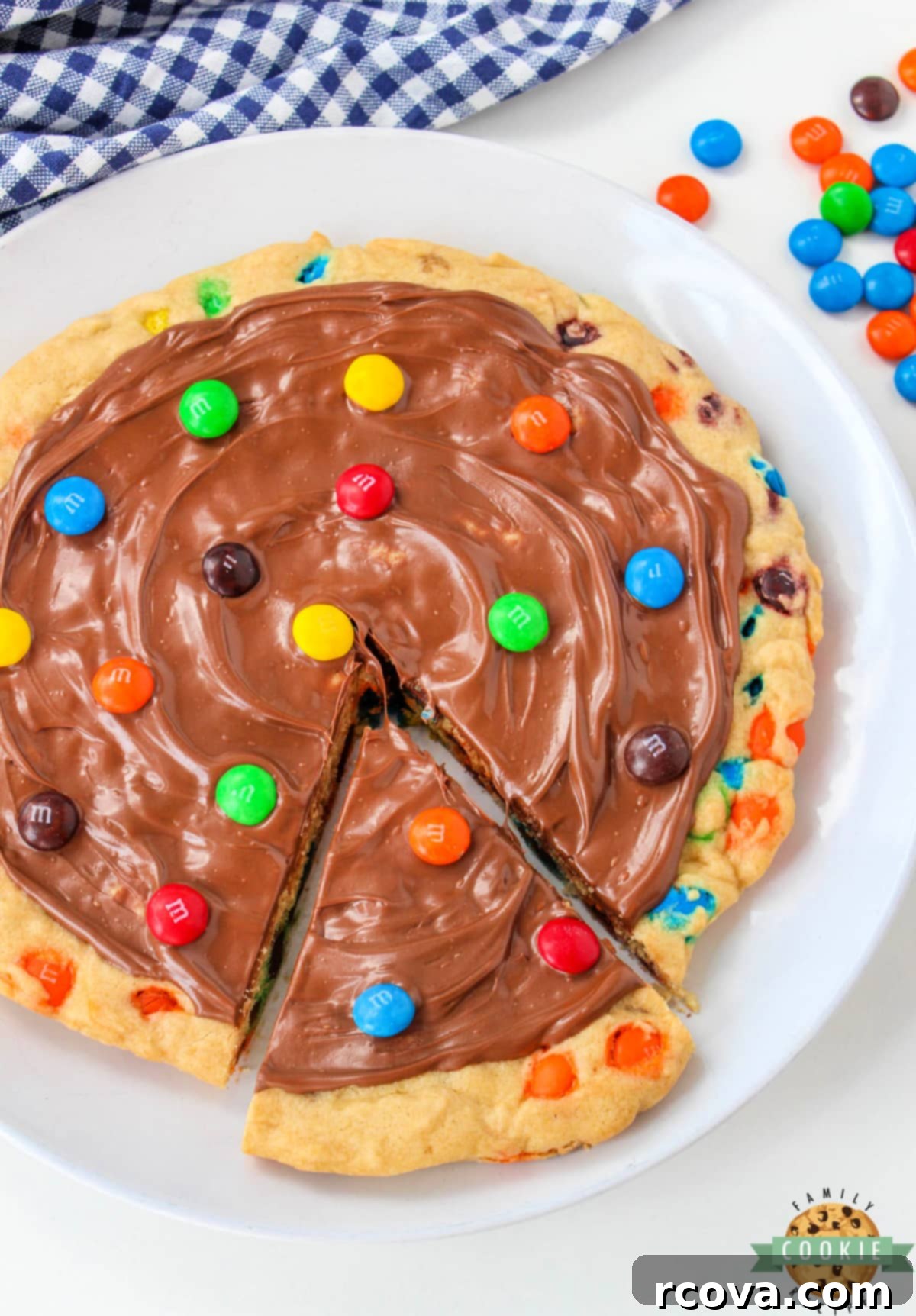 Vibrant M and M Cookie Creation 2 M&M Cookie Pizza is soft, chewy and covered in chocolate. This skillet cookie recipe is easy to make completely from scratch and everyone will love it!