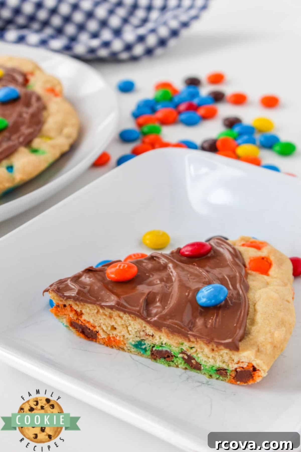 Vibrant M and M Cookie Creation 7 M&M Cookie Pizza is soft, chewy and covered in chocolate. This skillet cookie recipe is easy to make completely from scratch and everyone will love it!