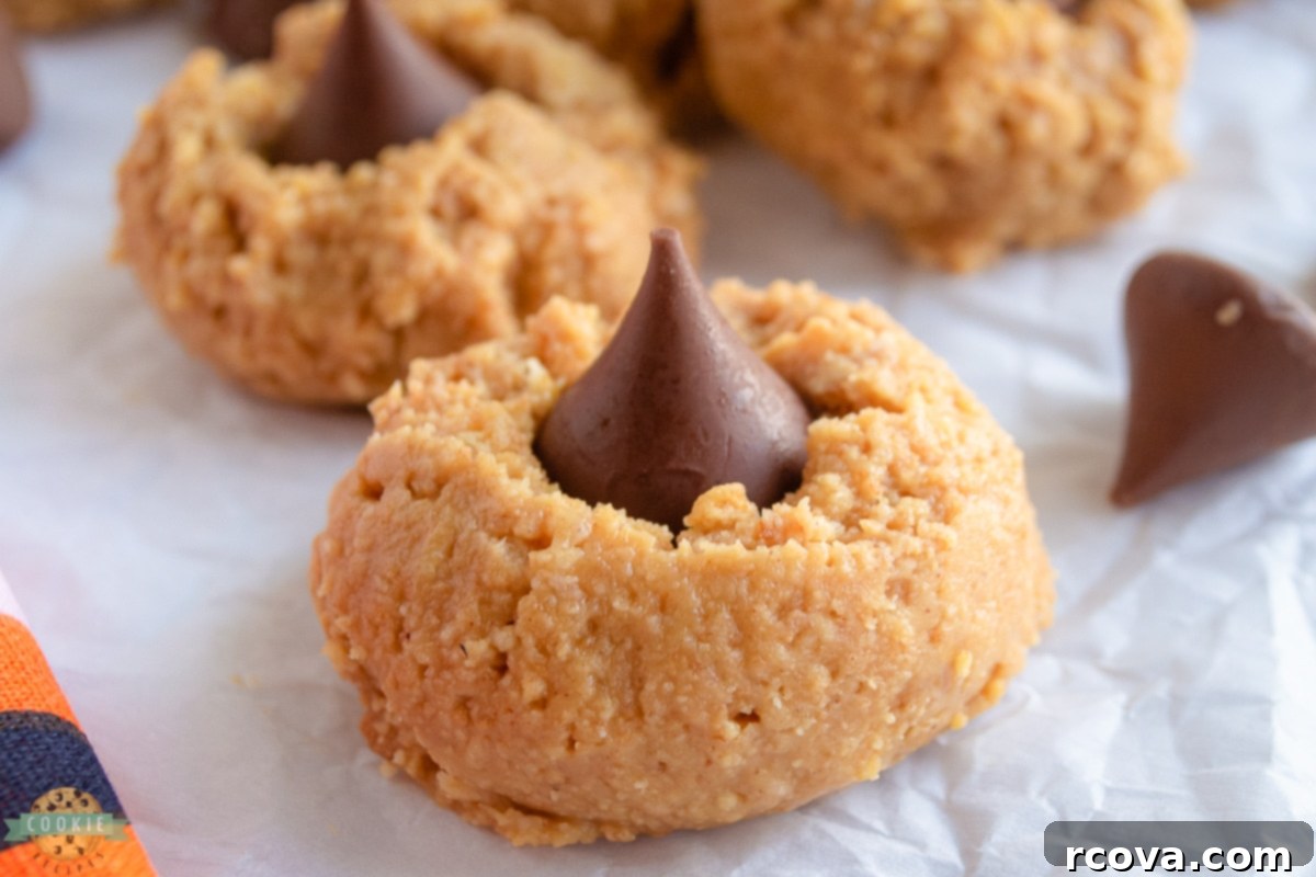 Effortless Peanut Butter Delights 7 Close up of a no bake peanut butter cookie with a classic chocolate kiss on top