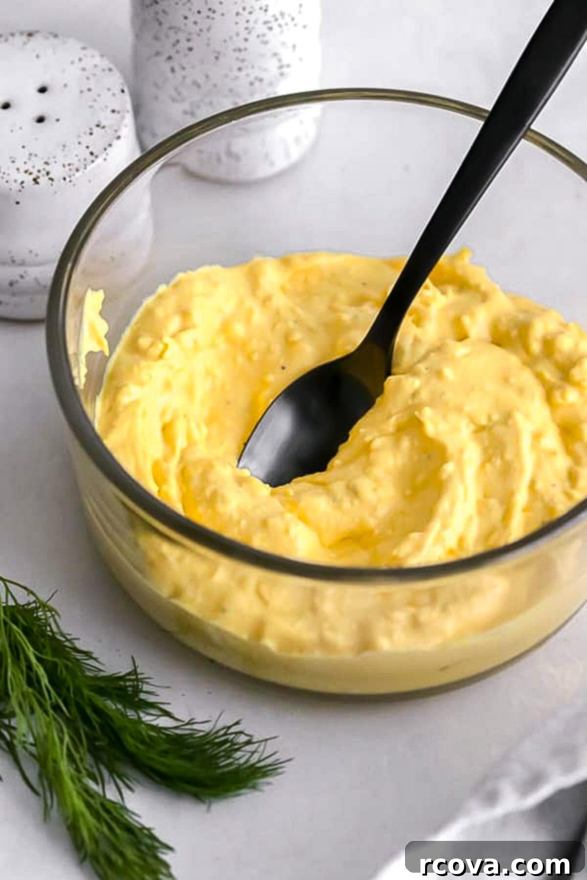 Instant Pot Deviled Eggs Fast & Fabulous 3 Close-up of hard-boiled egg halves, with yolks carefully scooped out, ready for the creamy filling preparation.