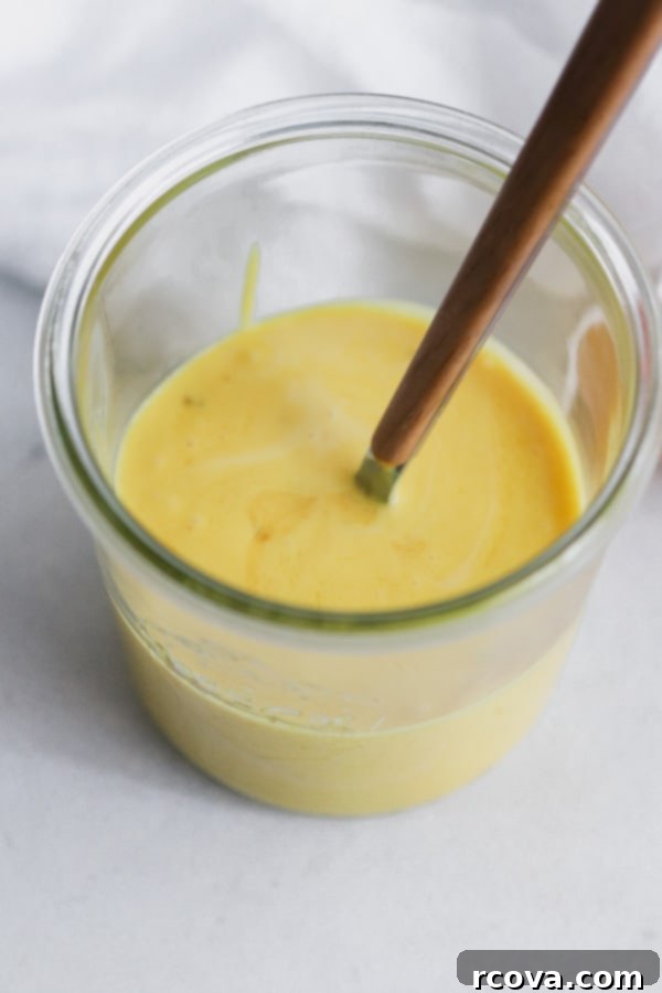 Easy Whole30 Blender Hollandaise 5 The blender in action, illustrating the process of emulsifying Whole30 Hollandaise Sauce with hot ghee.