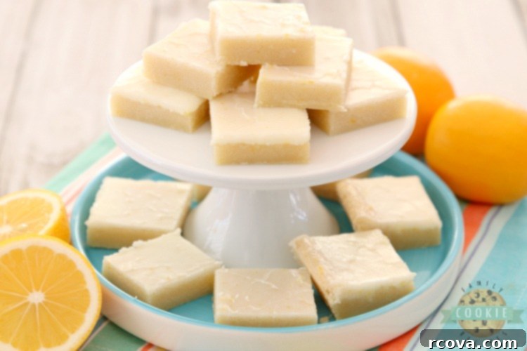 Sunshine Lemon Bars 6 A tray of freshly baked Lemon Sugar Cookie Bars cooling, covered with a bright lemon glaze.
