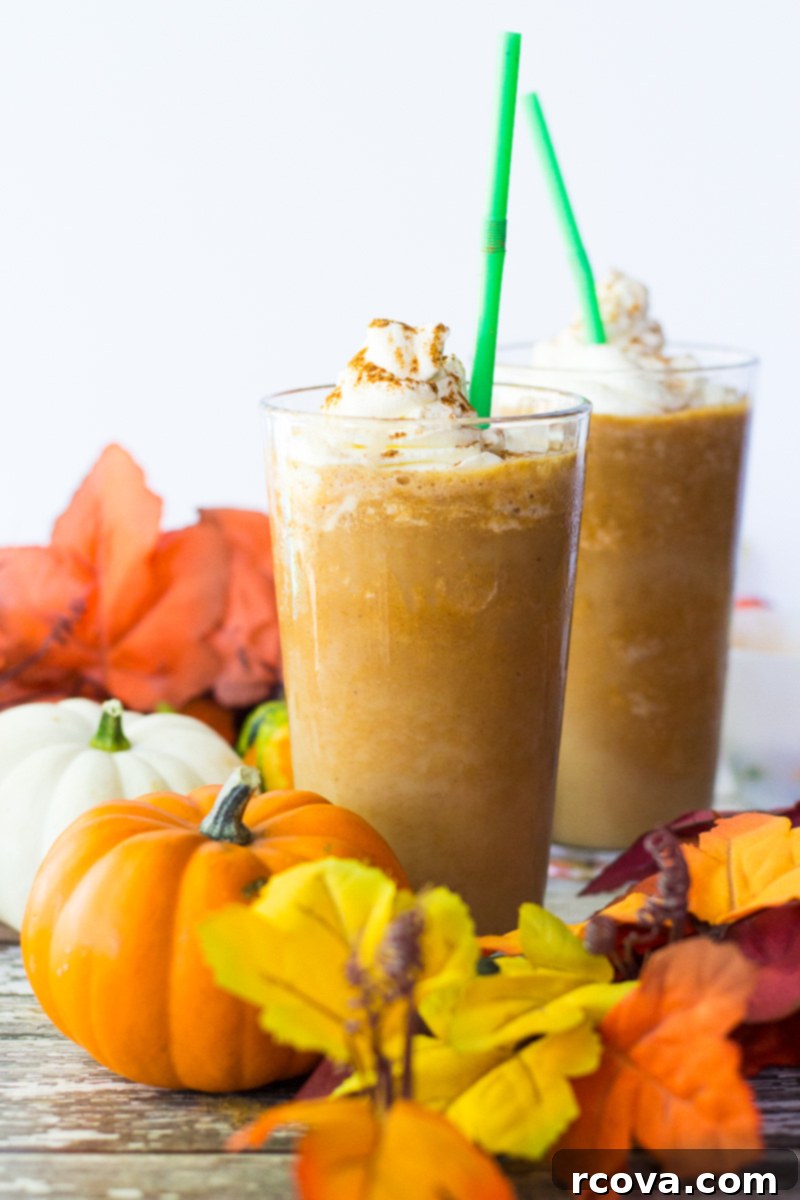 Sip into Fall: Pumpkin Spice Frappuccino 6 Two Pumpkin Spice Frappuccinos in mason jars, topped with whipped cream and spice