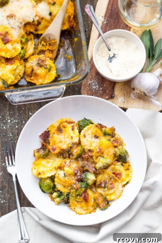 Butternut Squash Ravioli Casserole 5 A dish of creamy Butternut Squash Ravioli Bake garnished with fresh sage leaves.