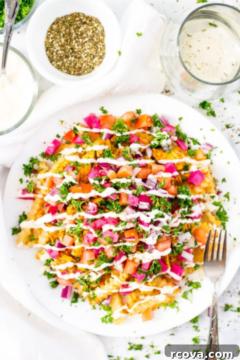Ultimate Chicken Shawarma Fries 2 Delicious Loaded Chicken Shawarma Fries with fresh toppings and creamy garlic sauce
