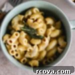 Golden Stovetop Butternut Mac & Cheese 6 mac and cheese cooked and served in an aqua color bowl