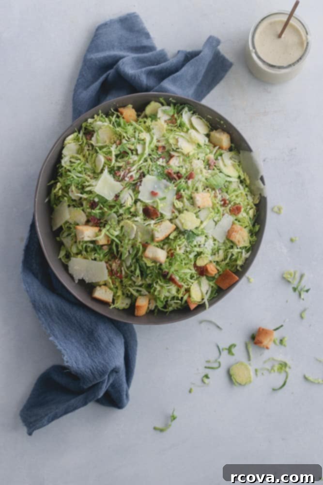 Deliciously Simple Shaved Brussels Sprout Caesar 2 Freshly prepared shaved Brussels sprout Caesar salad with bacon and croutons