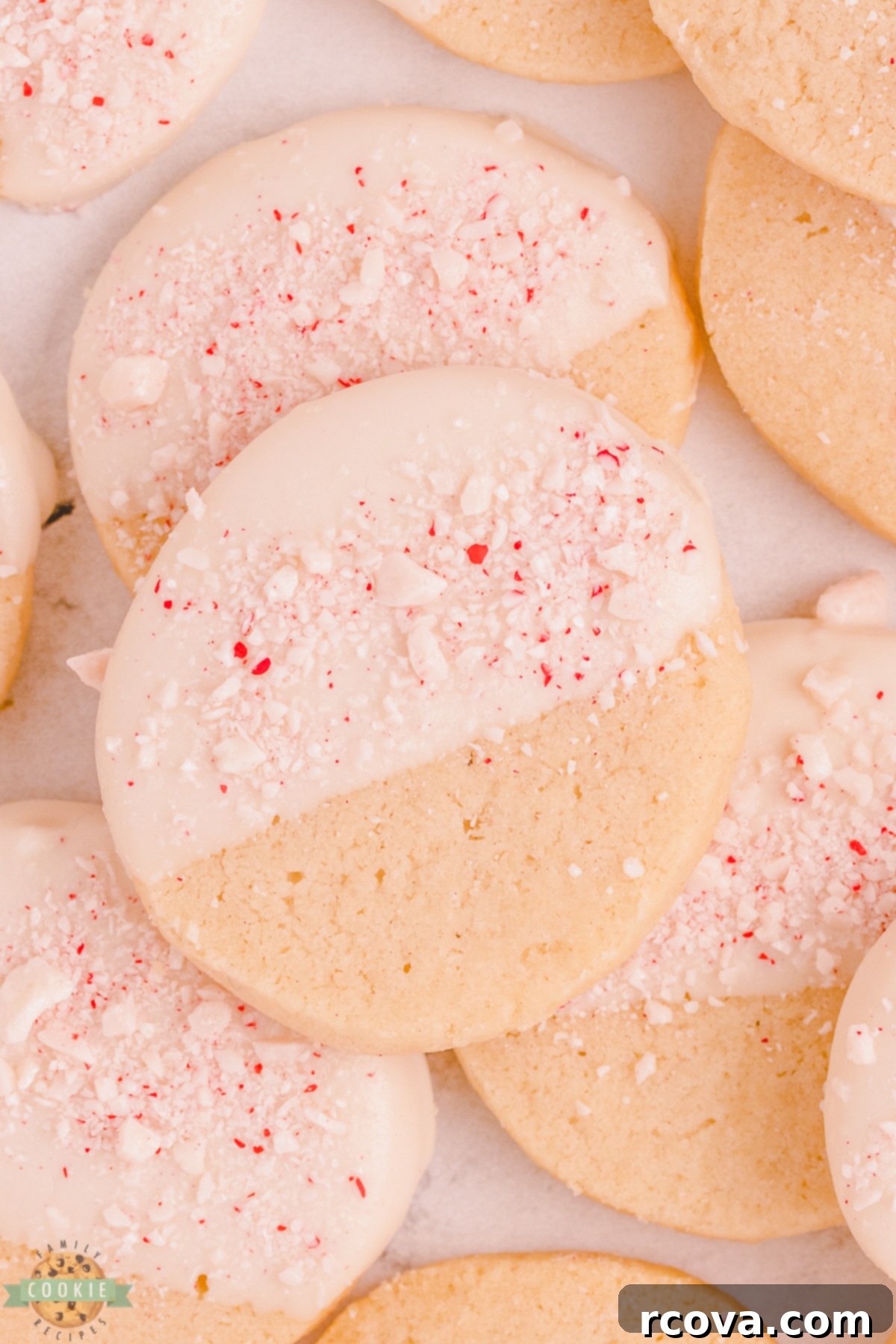 Buttery Peppermint Shortbread Delights 2 Delightful white chocolate-dipped peppermint shortbread cookies, perfect for festive gatherings.
