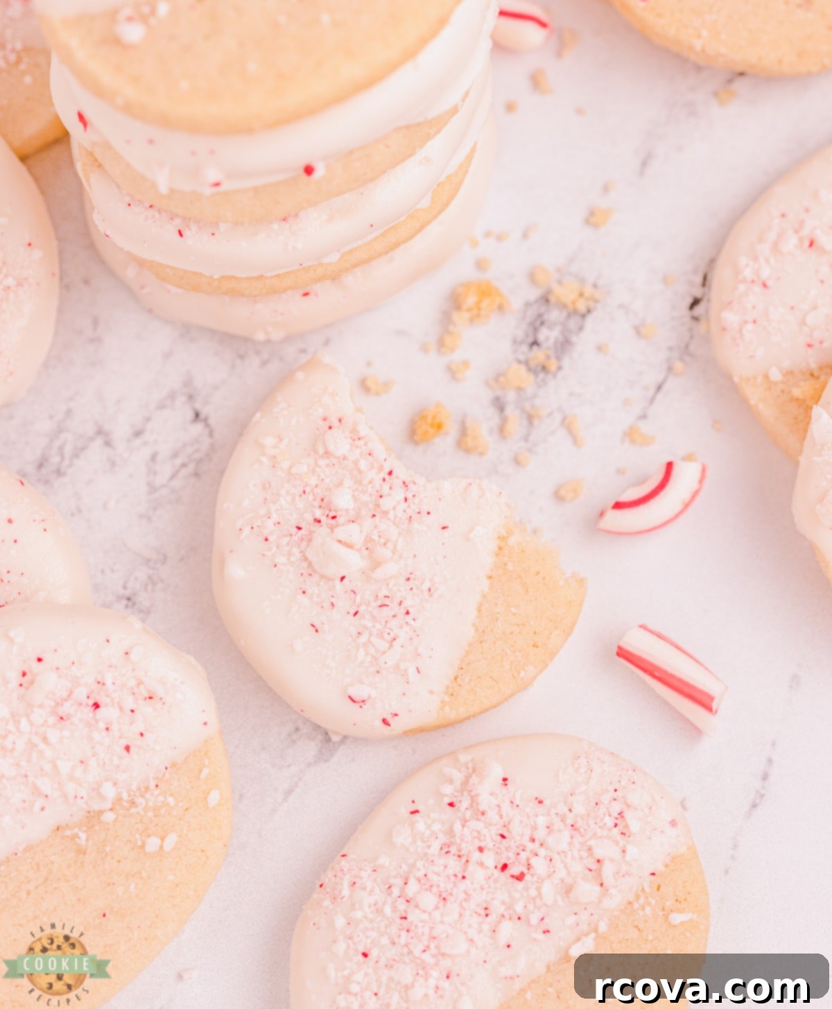 Buttery Peppermint Shortbread Delights 11 A bite taken out of a peppermint shortbread cookie, showing its delicate texture.