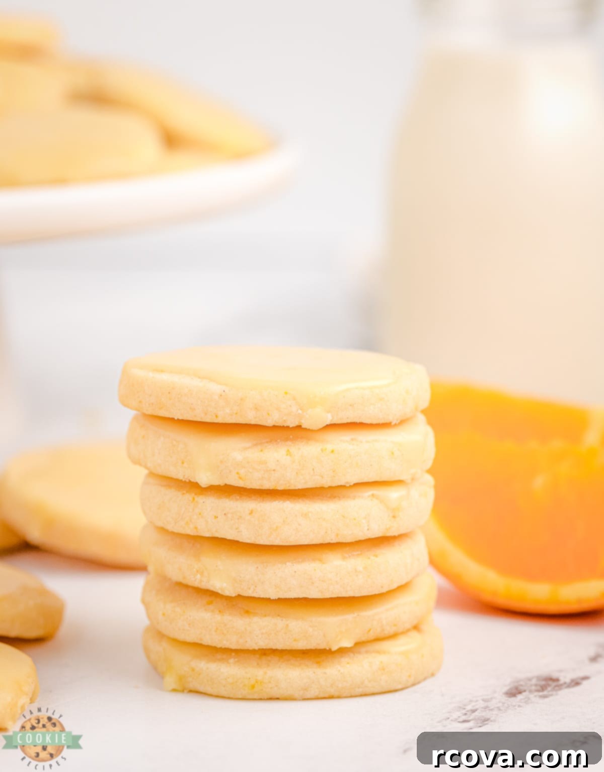 Zesty Orange Shortbread Bites 10 bright orange cookies in a stack