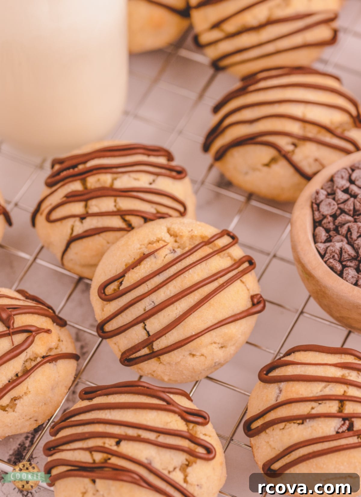 Melty Choc-Chip Perfection 3 Chocolate chip scookies cooling on a wire rack, ready for chocolate drizzle