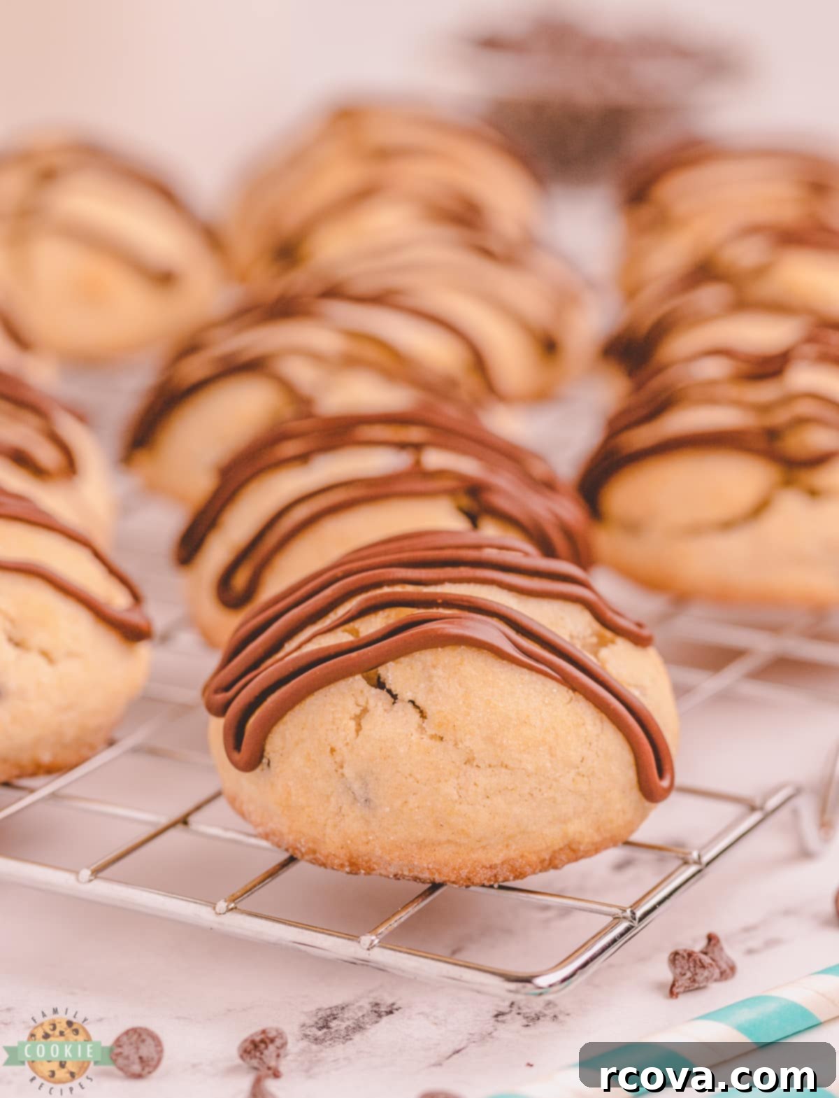 Melty Choc-Chip Perfection 4 Close-up of chocolate drizzle being applied to a warm chocolate chip scookie