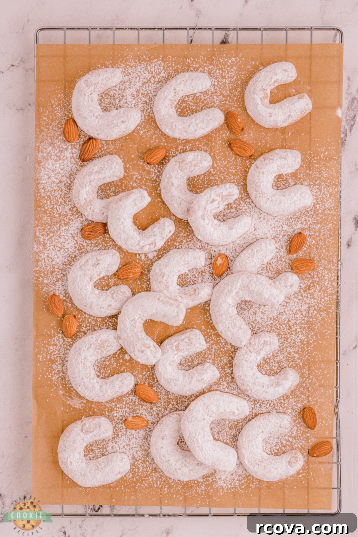 Golden Cinnamon Almond Moons 4 crescent cookies on parchment paper