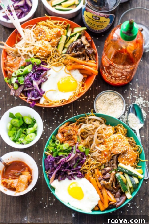 Dynamite Shrimp Noodle Bowls 2 Vibrant Bang Bang Shrimp Noodle Bowl topped with a fried egg, kimchi, and fresh vegetables