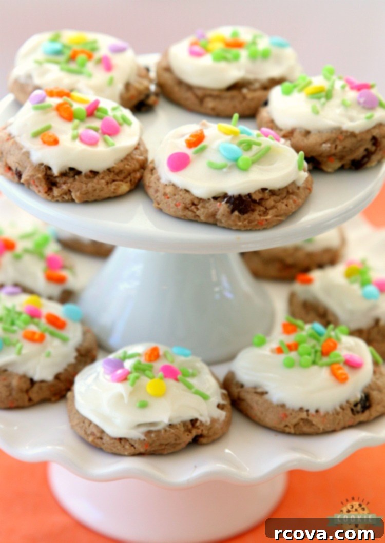 Silent Carrot Delights 2 Soft and chewy carrot cake cookies with cream cheese frosting on a cooling rack.