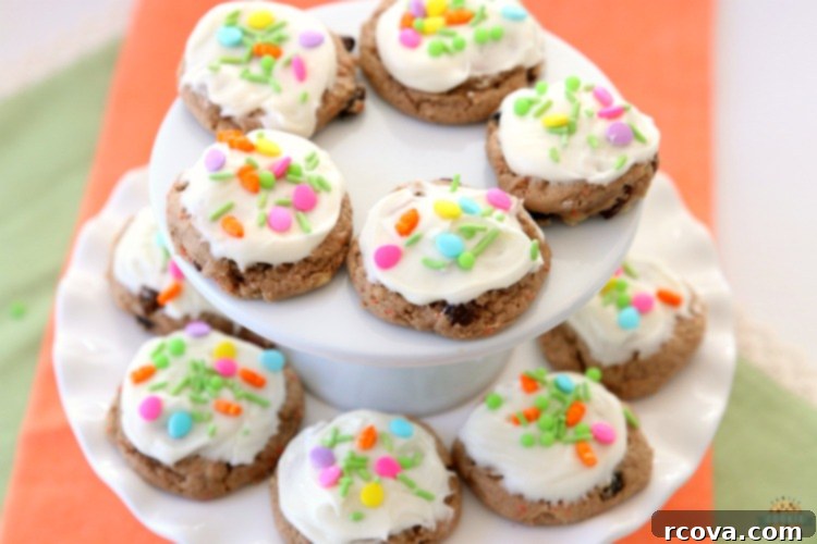 Silent Carrot Delights 10 Close-up of a stack of carrot cake cookies with cream cheese frosting.