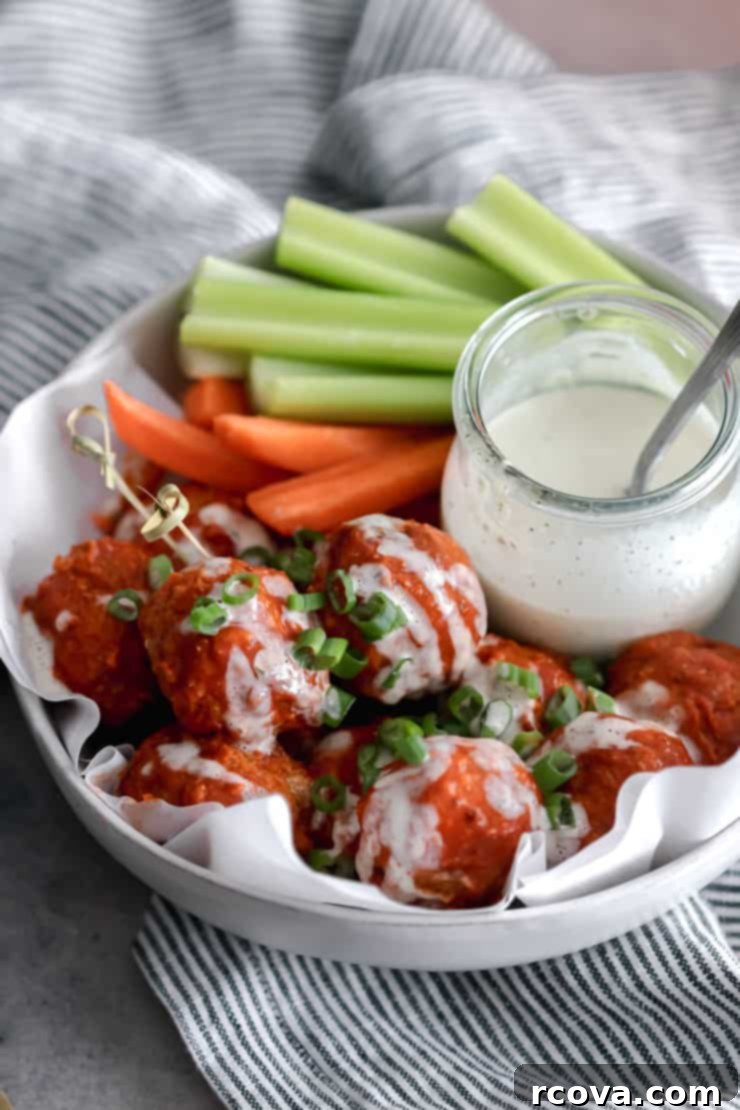 Crispy Air Fryer Buffalo Chicken Meatballs 5 Close-up of cooked air fryer buffalo chicken meatballs garnished with green onions