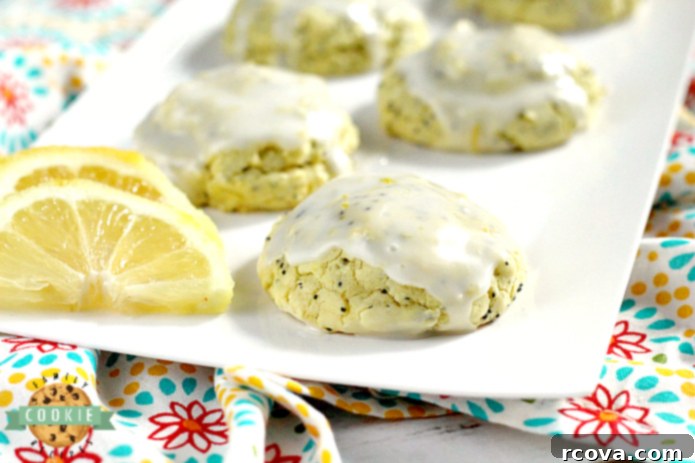 Sun-Kissed Lemon Poppy Delights 3 Close-up of baked Lemon Poppyseed Cookies without glaze, showcasing their soft texture and visible poppy seeds. Made with a lemon cake mix, lemon zest, poppy seeds, eggs, and butter.
