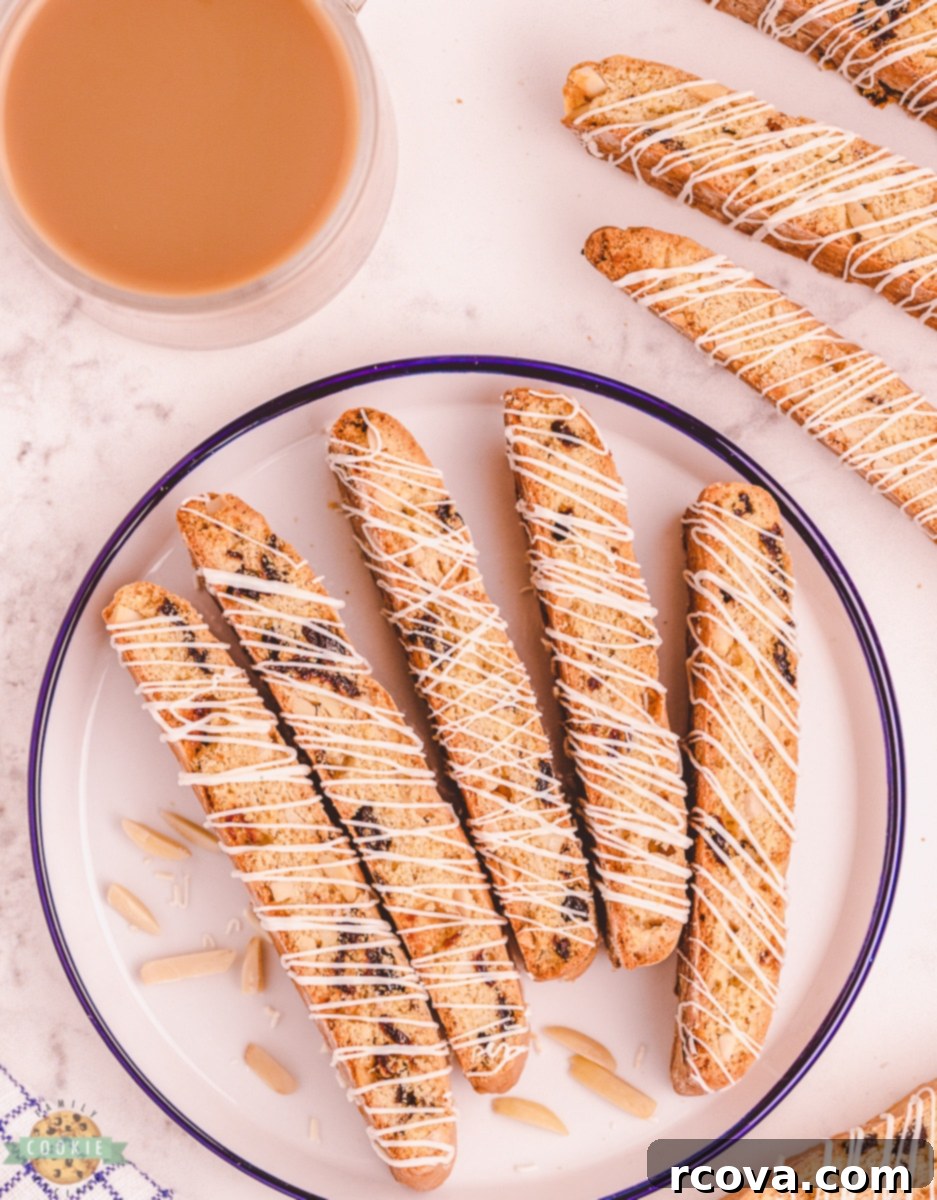 Double-Baked Cherry Delights 12 Overhead shot of cherry almond biscotti in a row on a baking sheet