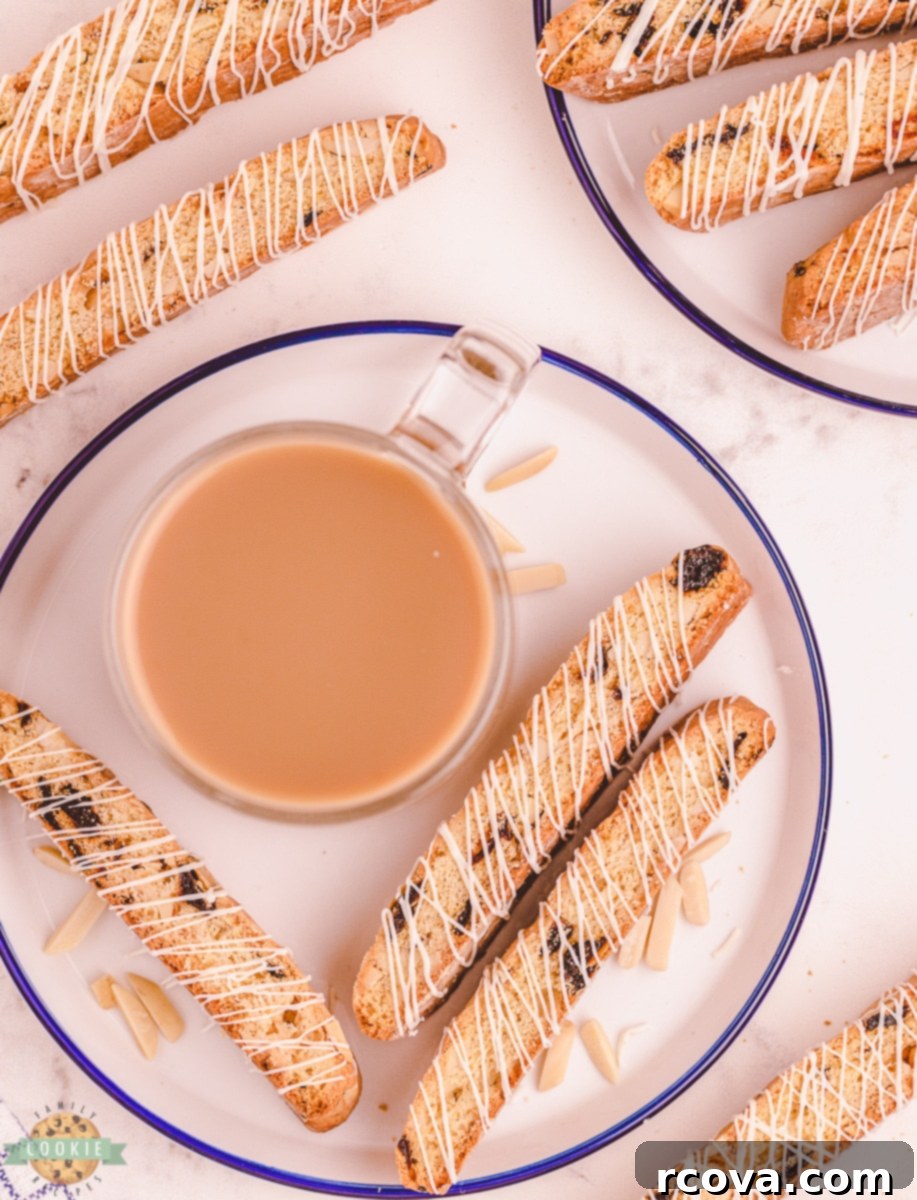Double-Baked Cherry Delights 4 Cherry almond biscotti with white chocolate, served alongside a steaming cup of coffee