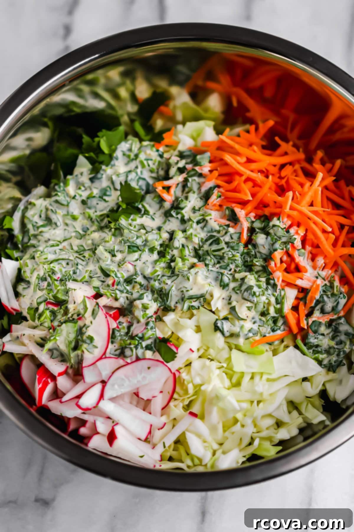Effortless Zesty Radish Slaw 5 Ingredients for Zesty Radish Slaw laid out, including shredded cabbage, carrots, radishes, cilantro, and jalapeño.