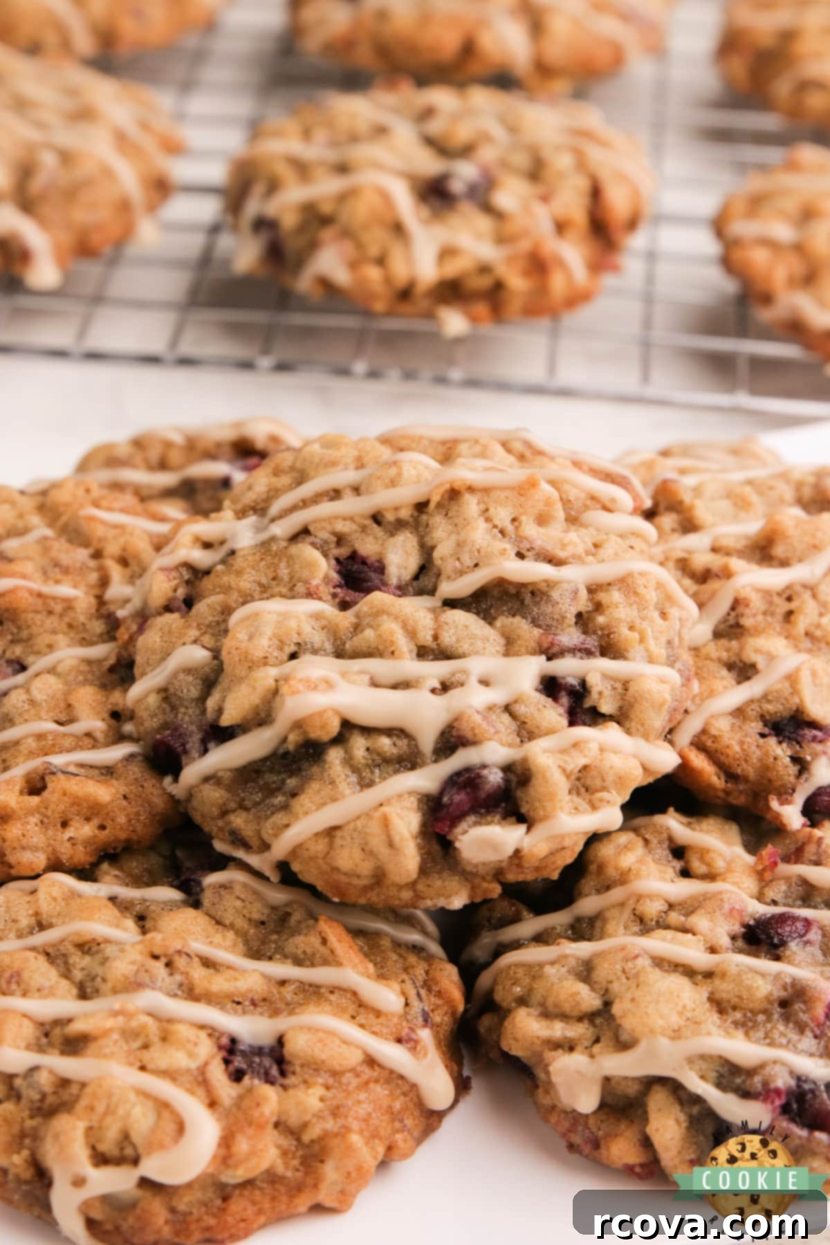 Ruby Glazed Pomegranate Oat Treats 2 Soft and chewy glazed pomegranate oatmeal cookies topped with maple glaze, showcasing their rich texture and vibrant pomegranate seeds.
