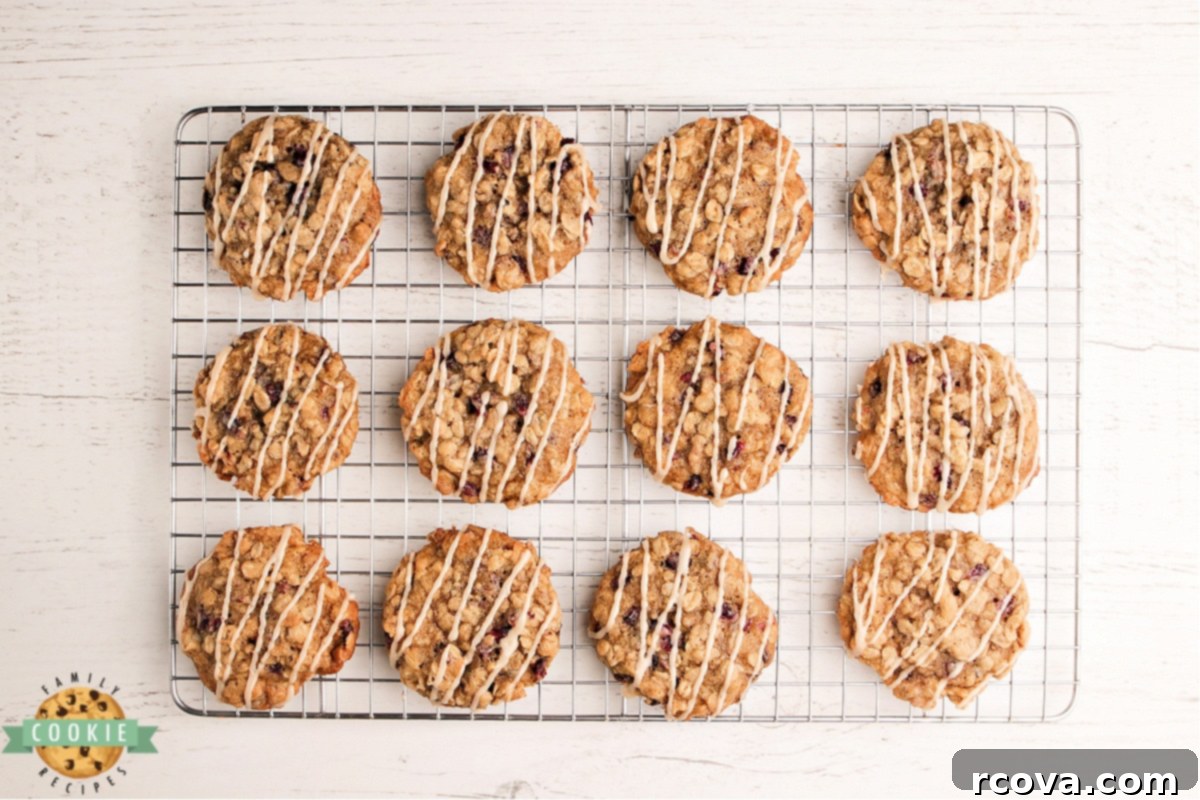 Ruby Glazed Pomegranate Oat Treats 11 Close-up of a glazed oatmeal cookie, showing the rich, inviting texture and the sheen of the maple glaze.