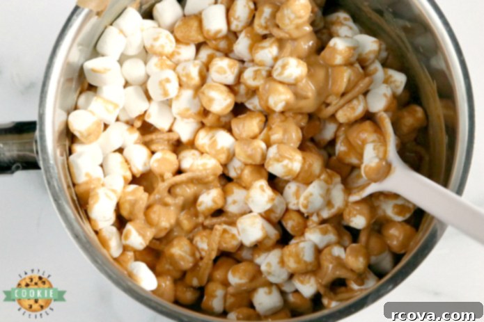 Gooey Peanut Butter Marshmallow No-Bake Bites 5 The four key ingredients for Marshmallow Peanut Butter No Bake Cookies: butterscotch chips, creamy peanut butter, chow mein noodles, and mini marshmallows, arranged for a clear ingredient showcase.