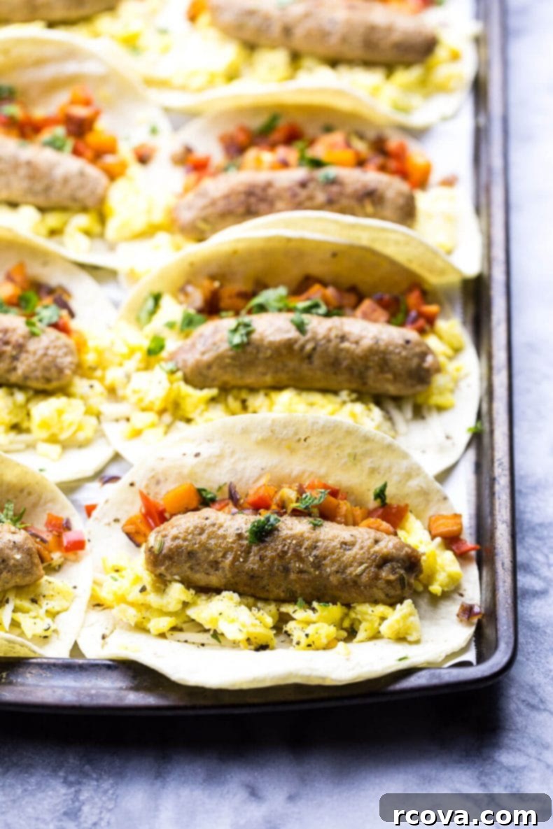 Batch Cook Breakfast Taquitos for Easy Mornings 6 Several breakfast taquitos arranged on a plate with a side of dipping sauce, showcasing their golden-brown crispiness.