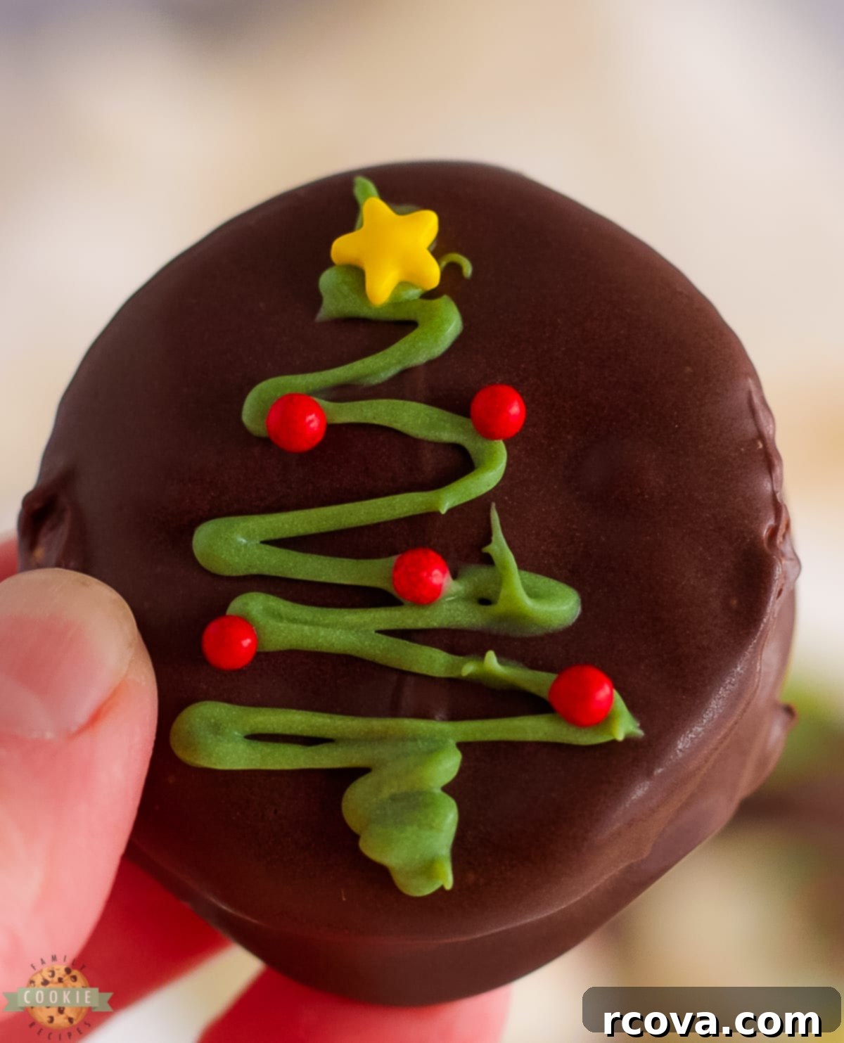 Crispy Chocolate Ritz Cookies 3 A festive Chocolate Ritz Cracker Cookie decorated with a green Christmas tree, showcasing holiday spirit.