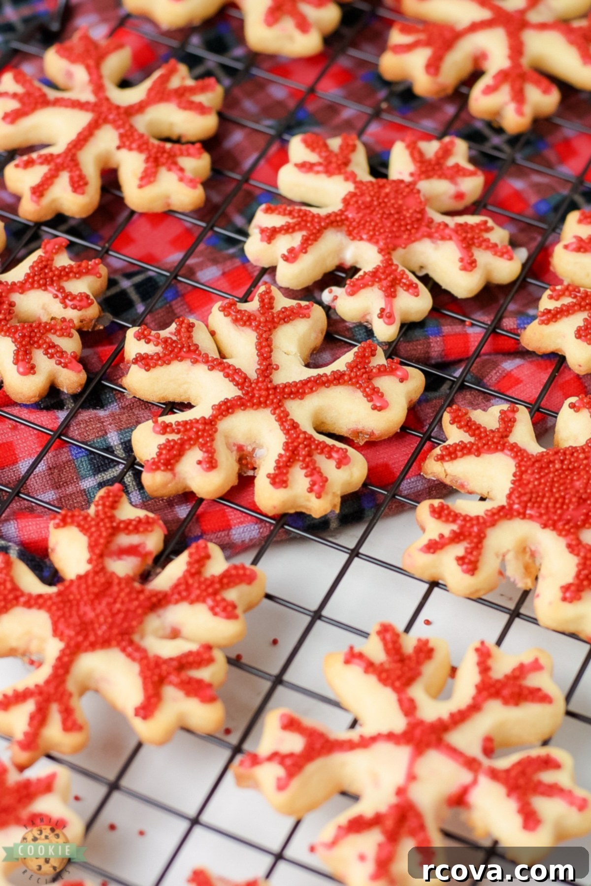 Peppermint Holiday Cookie Designs 7 peppermint snowflake cookies on a cooling rack