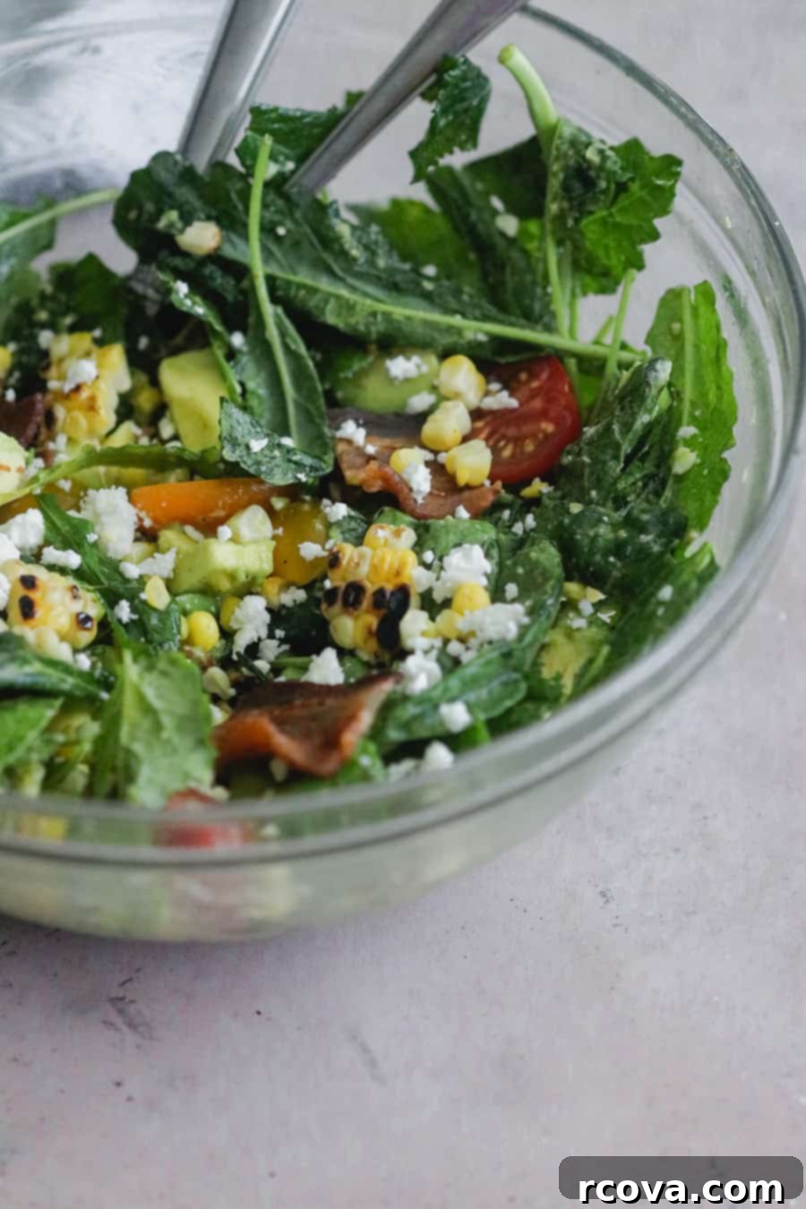 Chopped BLT Salad with Sweet Corn and Basil Vinaigrette 4 A large bowl of fresh blt chopped corn salad, showing all the ingredients mixed together with the basil vinaigrette.