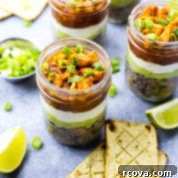 Party-Perfect Stacked Buffalo Chicken Dip Jars 9 A top-down view of Mini Buffalo Chicken Salsa Dip Jars, showcasing their colorful layers.