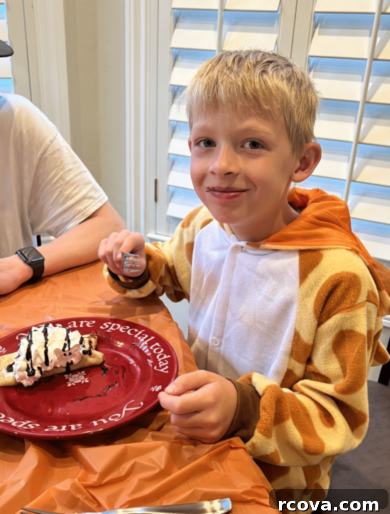 Artisan Almond Joy Cookies 11 Child in giraffe costume eating a crepe