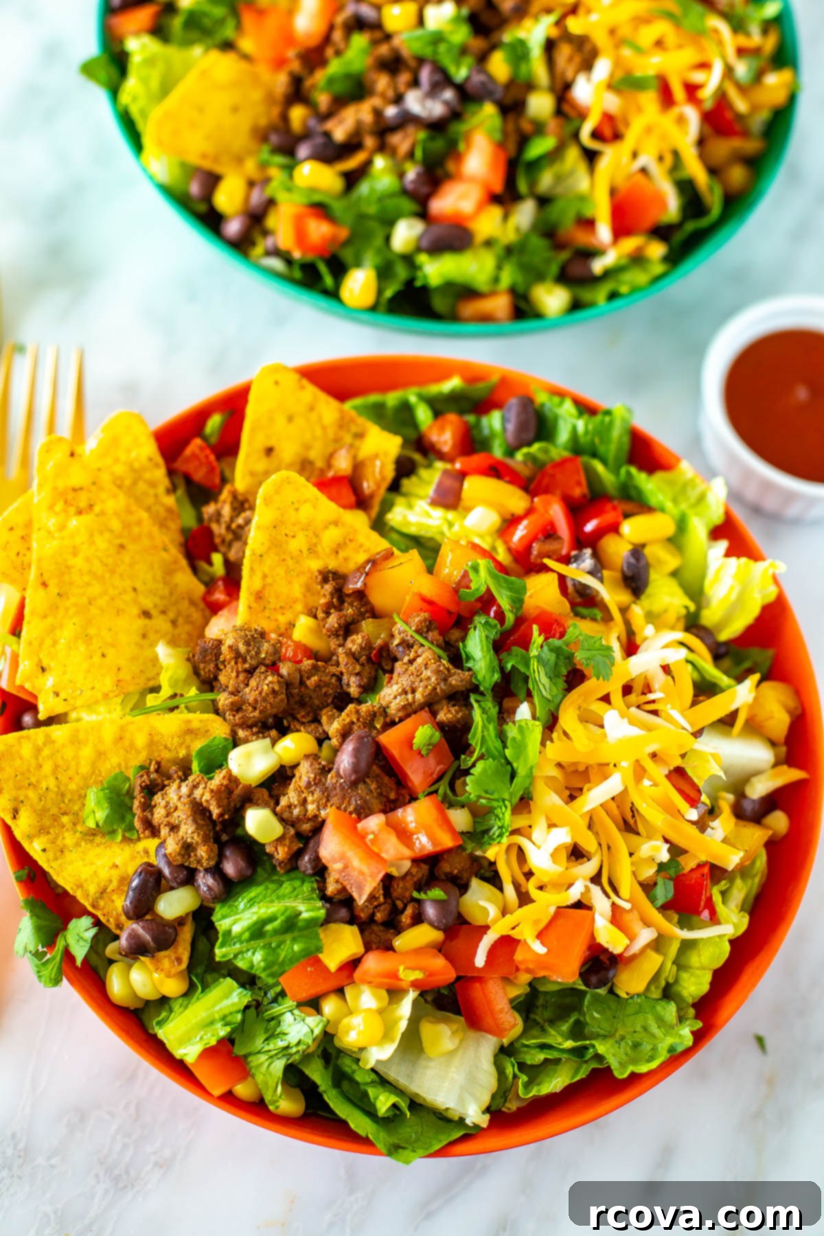 Crispy Dorito Taco Salad 9 Another mouthwatering close-up of a perfectly assembled bowl of Dorito Taco Salad, showing off the diverse textures and vibrant colors.