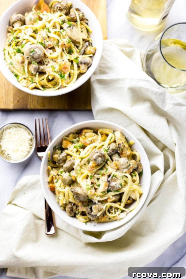 Velvety Linguine Chicken Tetrazzini 4 A vibrant shot of Linguine Chicken Tetrazzini in a serving bowl, highlighting the creamy sauce, tender chicken, and colorful bruschetta topping.