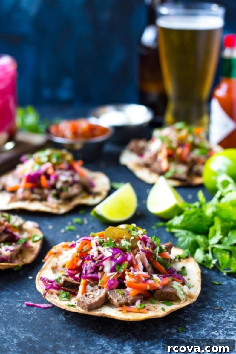 Korean BBQ Kalbi Tacos with Fresh Citrus Slaw 8 A top-down view of a beautifully assembled Kalbi Beef Taco, garnished with fresh cilantro and sesame seeds, highlighting its irresistible appeal.