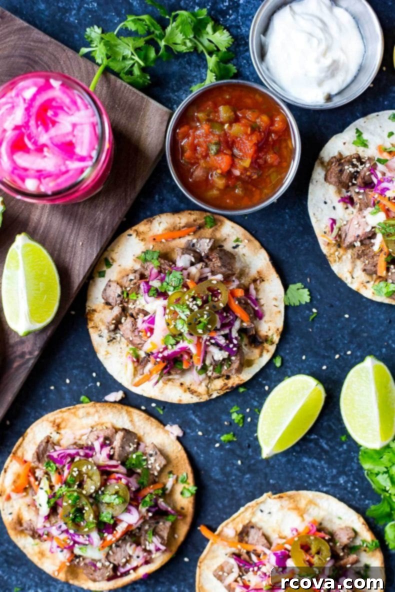 Korean BBQ Kalbi Tacos with Fresh Citrus Slaw 10 A beautifully presented serving of Kalbi Beef Tacos with all the fixings, emphasizing their appeal as a satisfying and exotic meal.