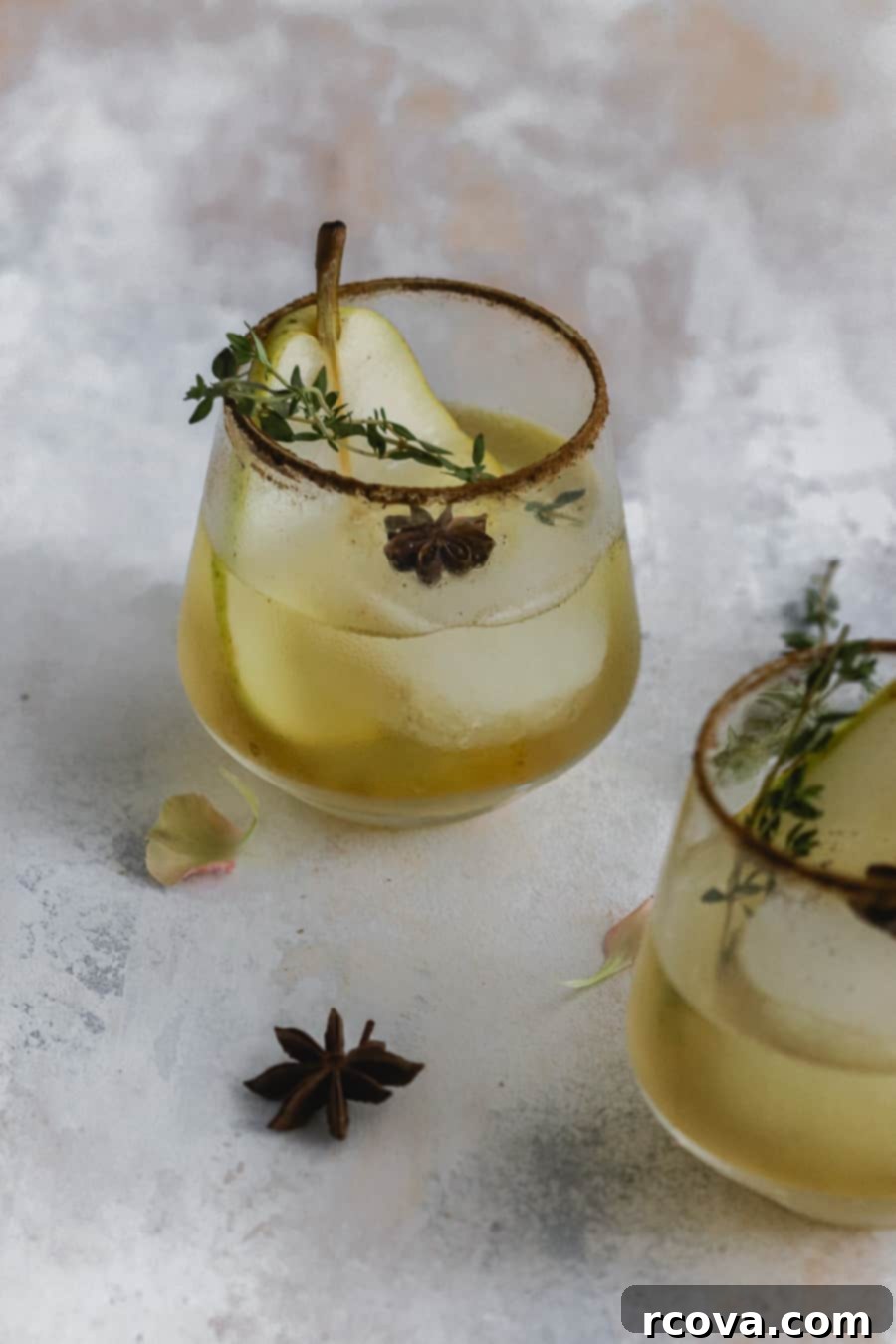 Golden Pear Gin Sparkler 5 Pear Gin Fizz garnished with pear slice, thyme, and star anise