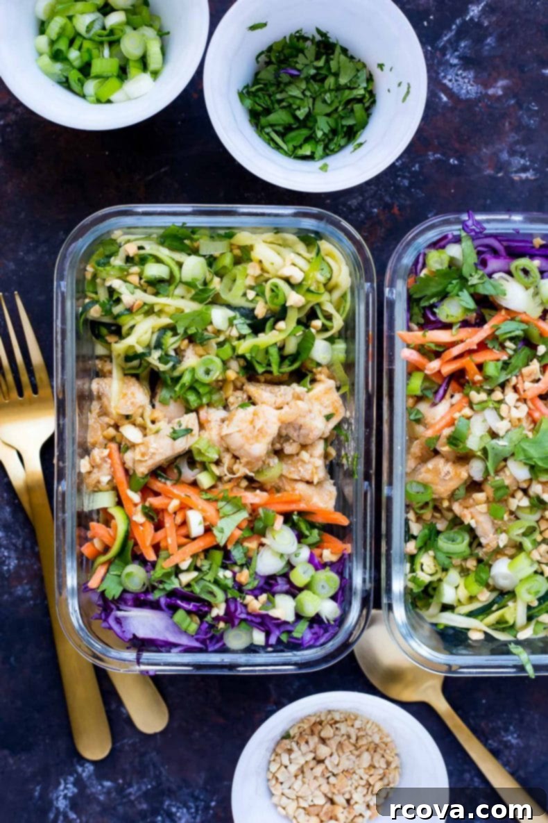 Low-Carb Zucchini Noodle Pad Thai Bowls 4 Close-up of vibrant Spiralized Zucchini Pad Thai Chicken Meal Prep Bowls, a healthy low-carb Thai takeout alternative with zucchini noodles, carrots, red cabbage, and a flavorful sauce.