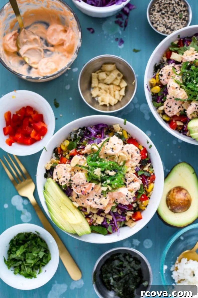 Spicy Creamy Shrimp Poke Delight 2 Delicious Creamy Sriracha Shrimp Poke Bowls featuring seaweed salad, lemongrass corn, avocado, and crispy wonton strips