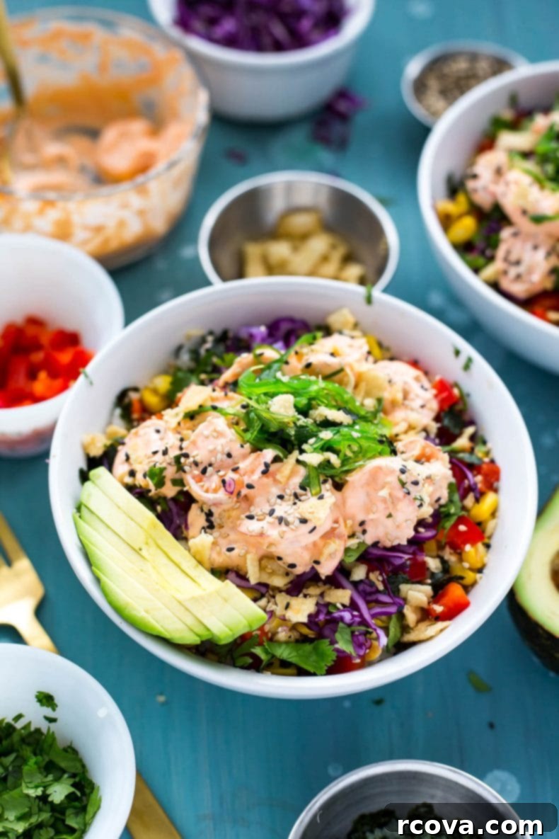 Spicy Creamy Shrimp Poke Delight 6 A beautifully arranged Creamy Sriracha Shrimp Poke Bowl with vibrant toppings including avocado and seaweed salad.