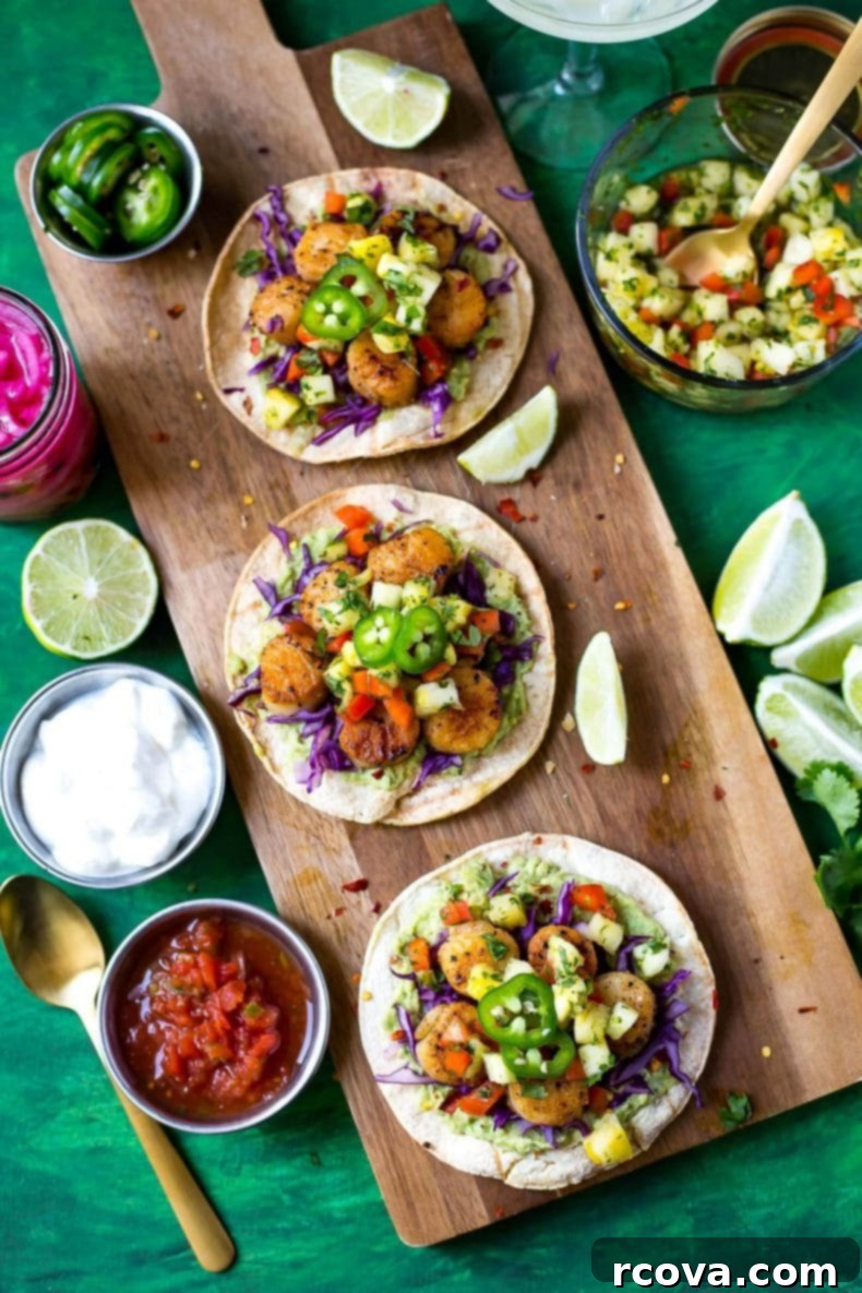 Sun Kissed Scallop Tacos with Pineapple Zing 9 Delicious Seared Scallop Tacos with Pineapple Salsa served on corn tortillas, garnished with fresh cilantro and lime wedges - perfect for a vibrant meal.