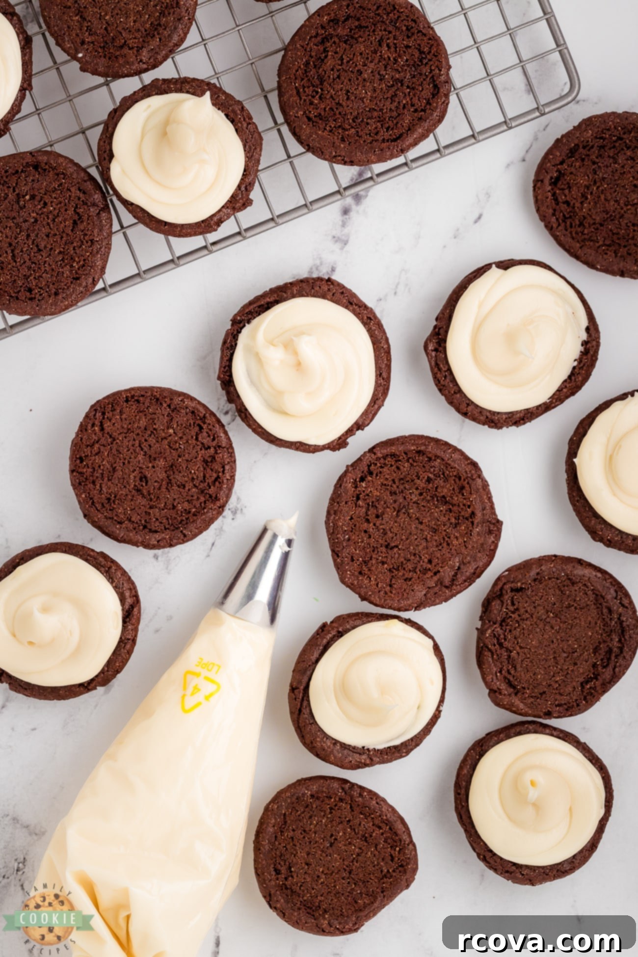 DIY Oreos: So Simple, So Sweet 7 Adding cream cheese frosting to homemade Oreo cookies with a piping bag