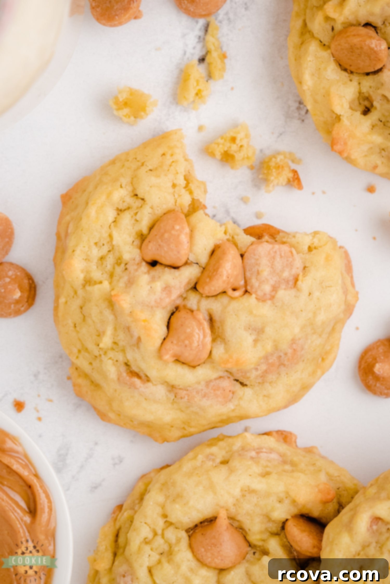 Peanut Butter Banana Bliss Bites 8 A close-up of a peanut butter banana cookie with a bite taken out, revealing its soft, moist interior and embedded peanut butter chips.