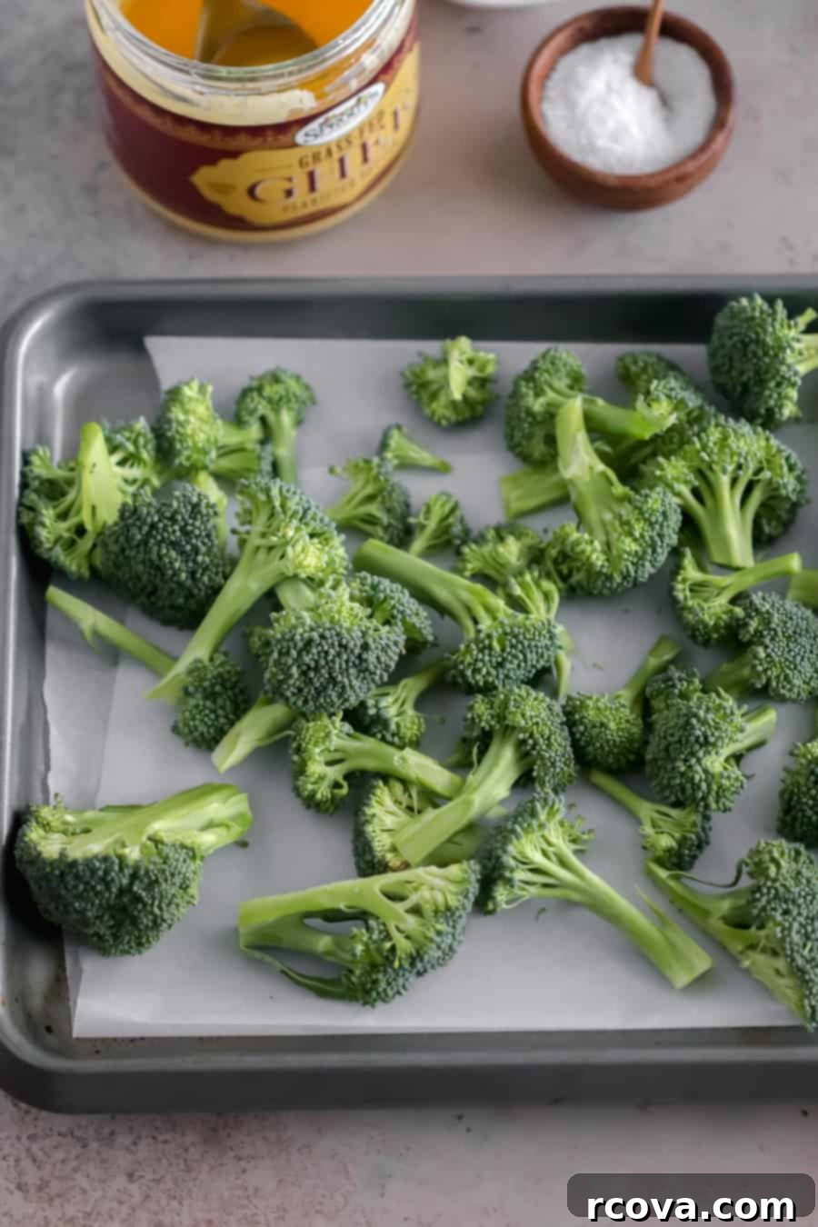 The Easiest Oven-Roasted Broccoli 3 easy roasted broccoli ingredients on a baking sheet