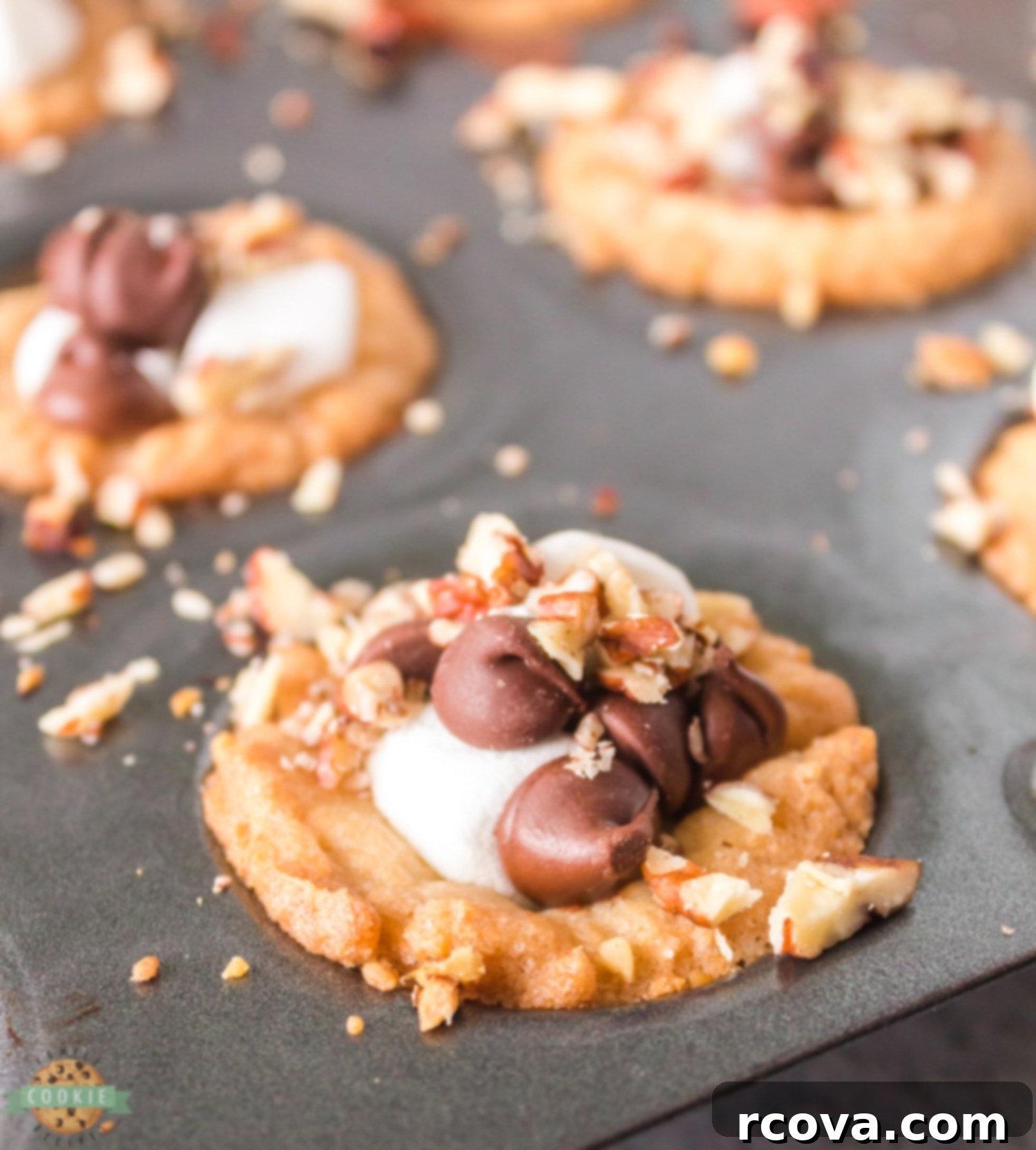 Decadent Rocky Road Cookie Cups 3 rocky road cookies baking in a mini muffin tin