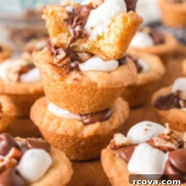 Decadent Rocky Road Cookie Cups 6 rocky road cookie cups featuring melted chocolate, marshmallows, and pecans