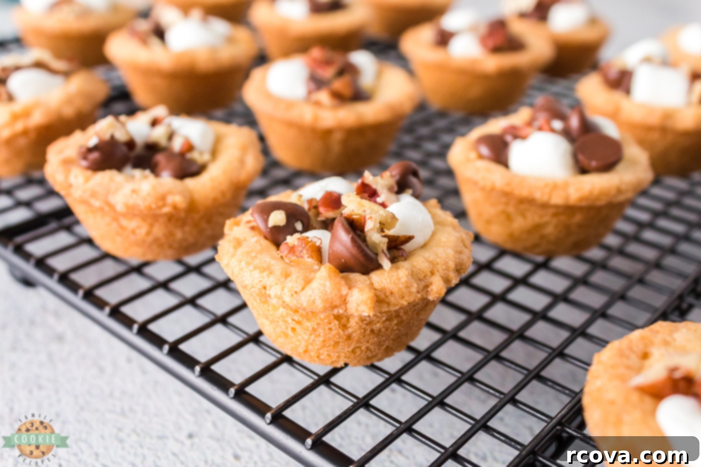 Decadent Rocky Road Cookie Cups 7 rocky road cookies cooling on a wire rack